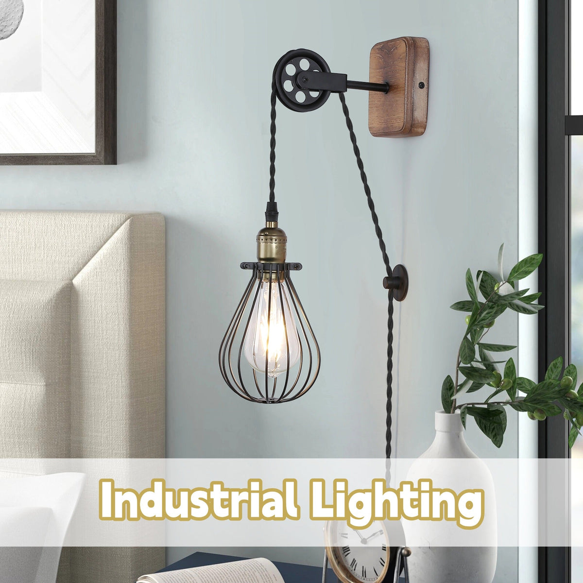 Industrial pulley plug-in wall sconce with natural wood backplate and black wire cage shade