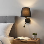 Black fabric shade wall sconce with adjustable LED reading light