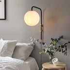 Opal Globe Plug-In Wall Sconce with Matte Black and Brass Finish