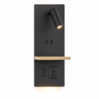The black wall plate frames an adjustable LED spotlight, with two additional 3W backlights delivering a welcoming warm-white wash. A small wood shelf creates a resting place for glasses or a phone, while USB-A, USB-C, and a built-in outlet add everyday practicality. 